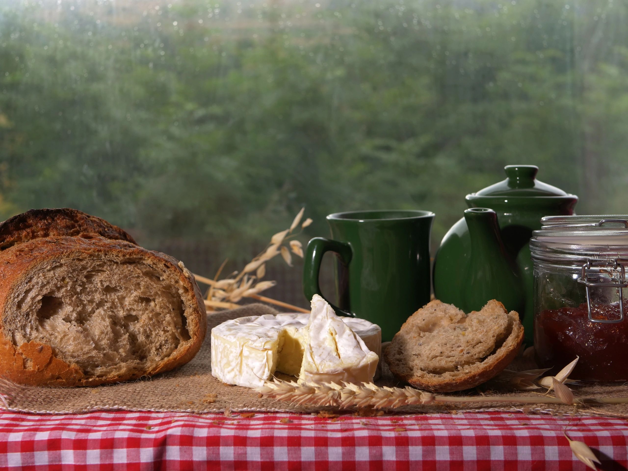 Nordic breakfast table with bread, cheese, and tea