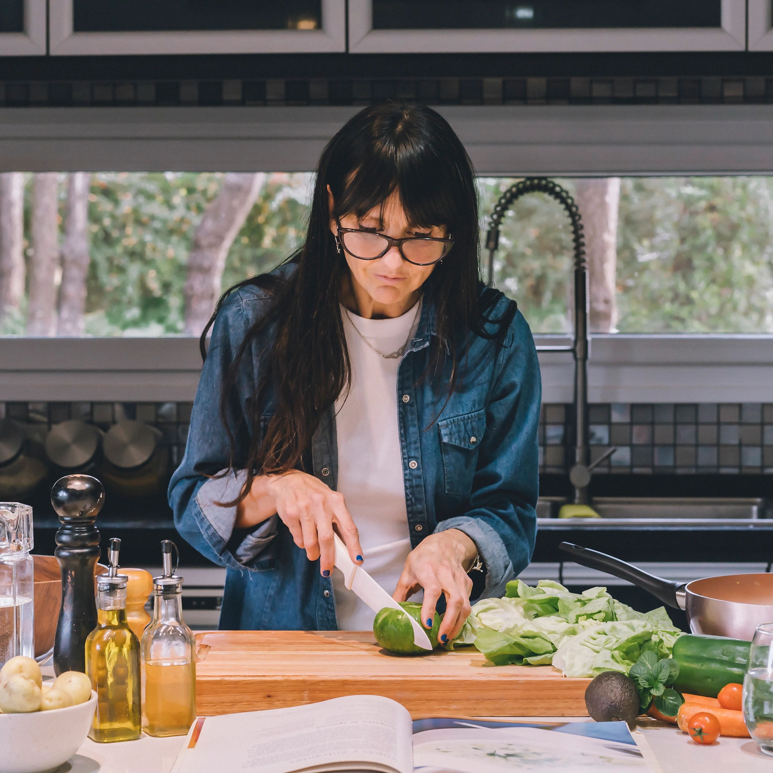 Person reading a recipe while preparing food