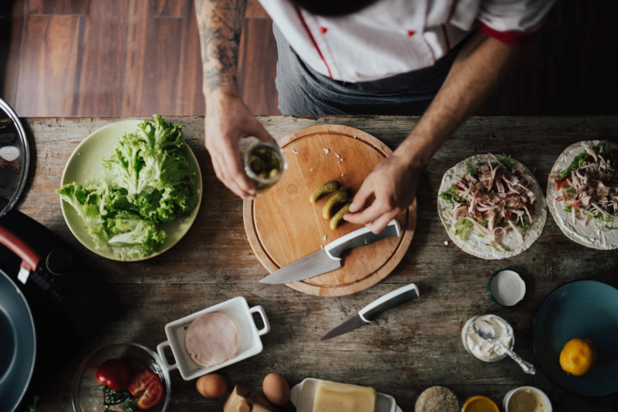 Cook preparing ingredients on a cutting board